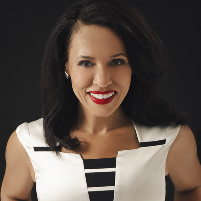 a person in a white and striped top with long dark hair